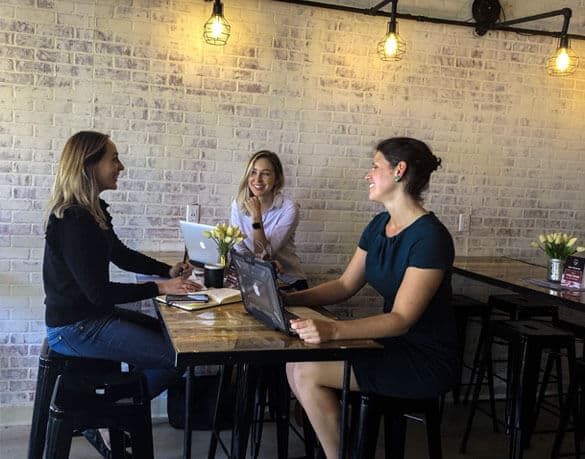 Image of Michelle and Amanda enjoying lunch with a client